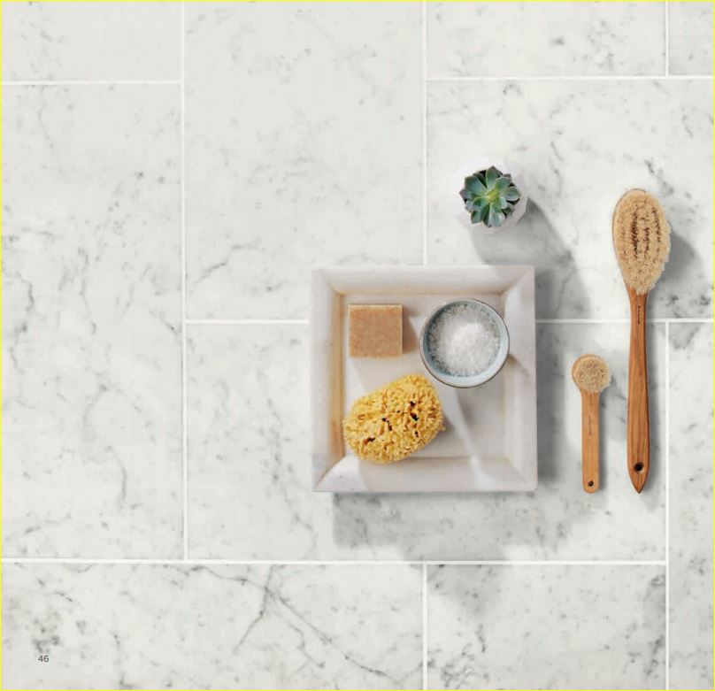 Close-up of rounded pebble mosaic tiles in neutral tones