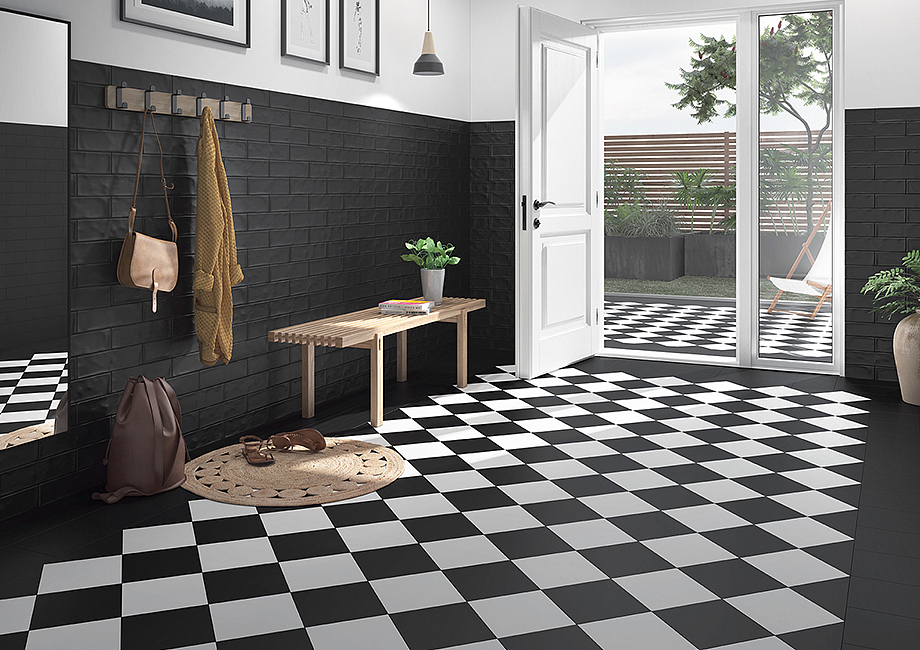 Modern hallway with black and white checkerboard tiles and open patio door