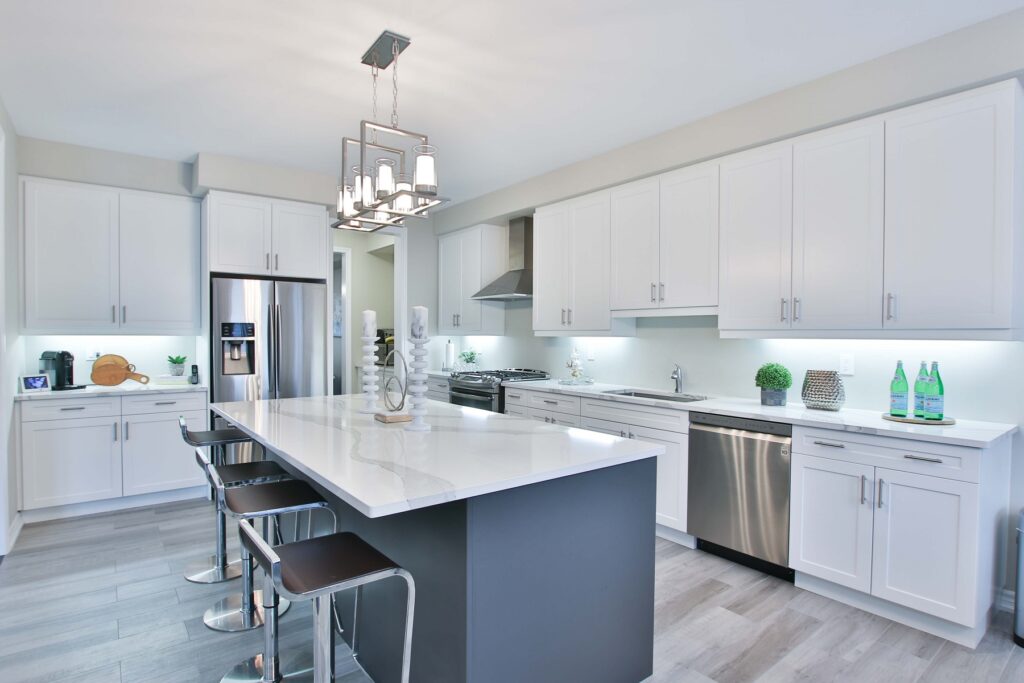Light kitchen with dining table placed near large window