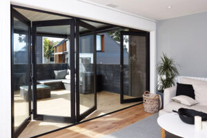 Compact bifold door installed in small modern living room