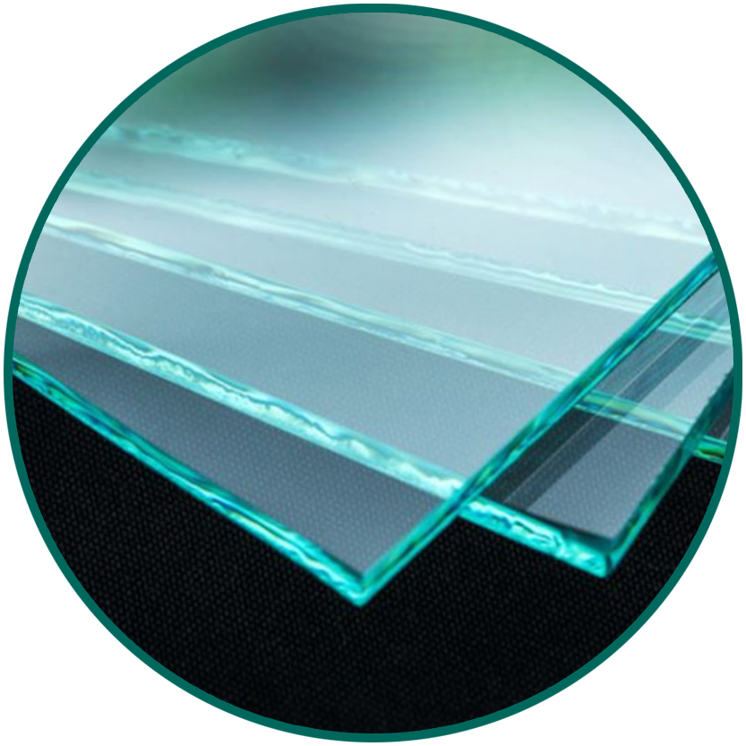 Stacked sheets of clear tempered glass panels with teal tint on the edges