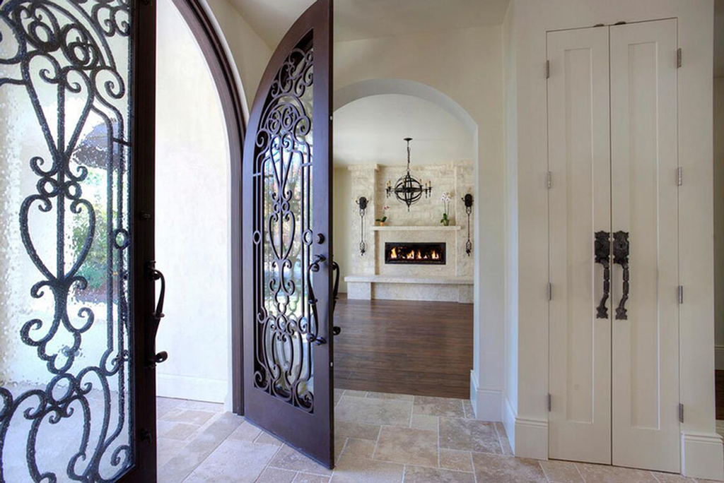 Dimly lit showroom interior displaying modern doors and large glass openings