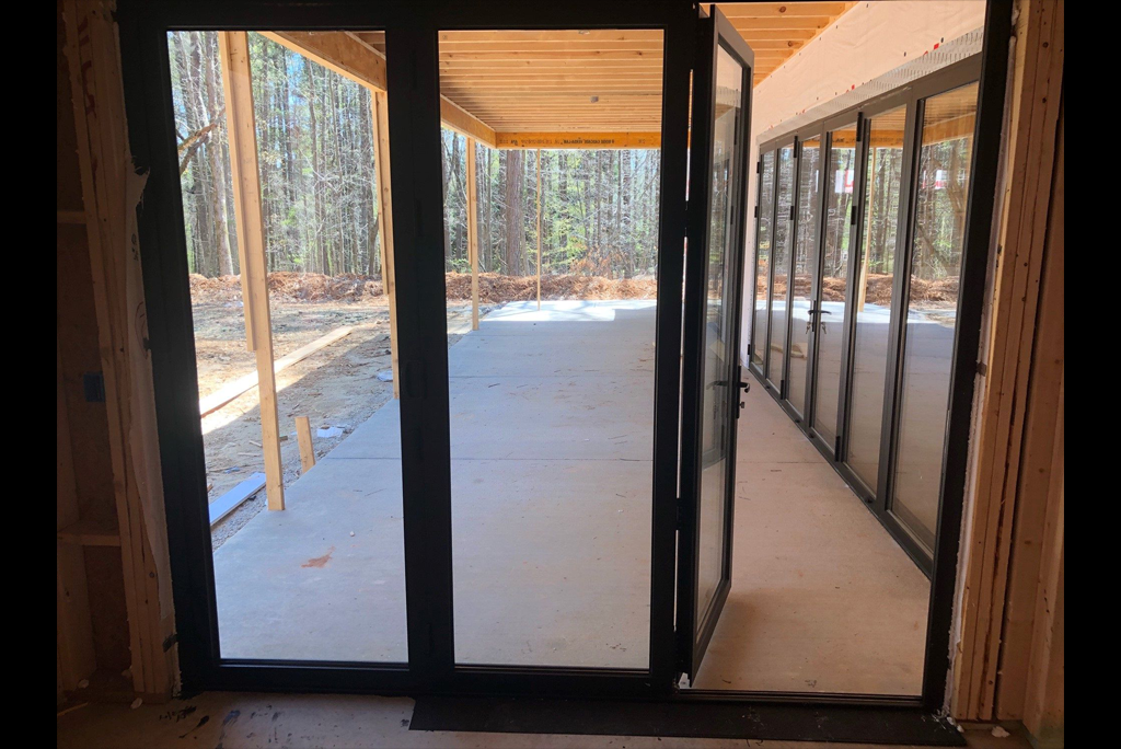 Swinging glass door with bold black frame