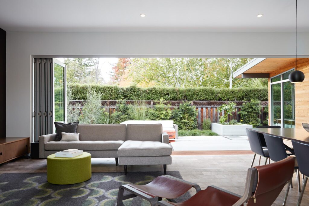 White bifold doors opening to patio