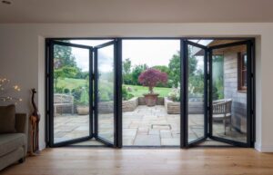Outdoor lounge with open folding doors