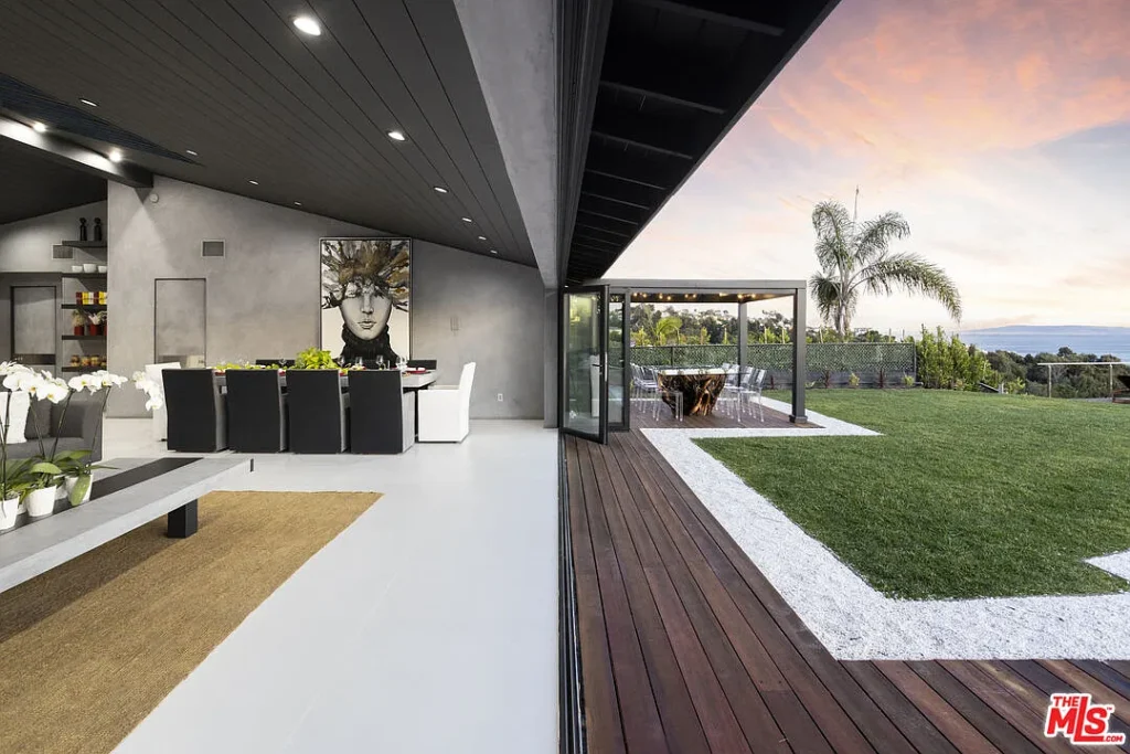 Contemporary lounge connected to spacious deck and pool