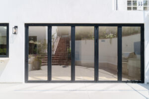 Modern aluminium bifold doors opening to patio