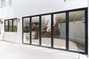 Bifold door fully opened to outdoor patio area
